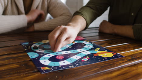 people playing a board game