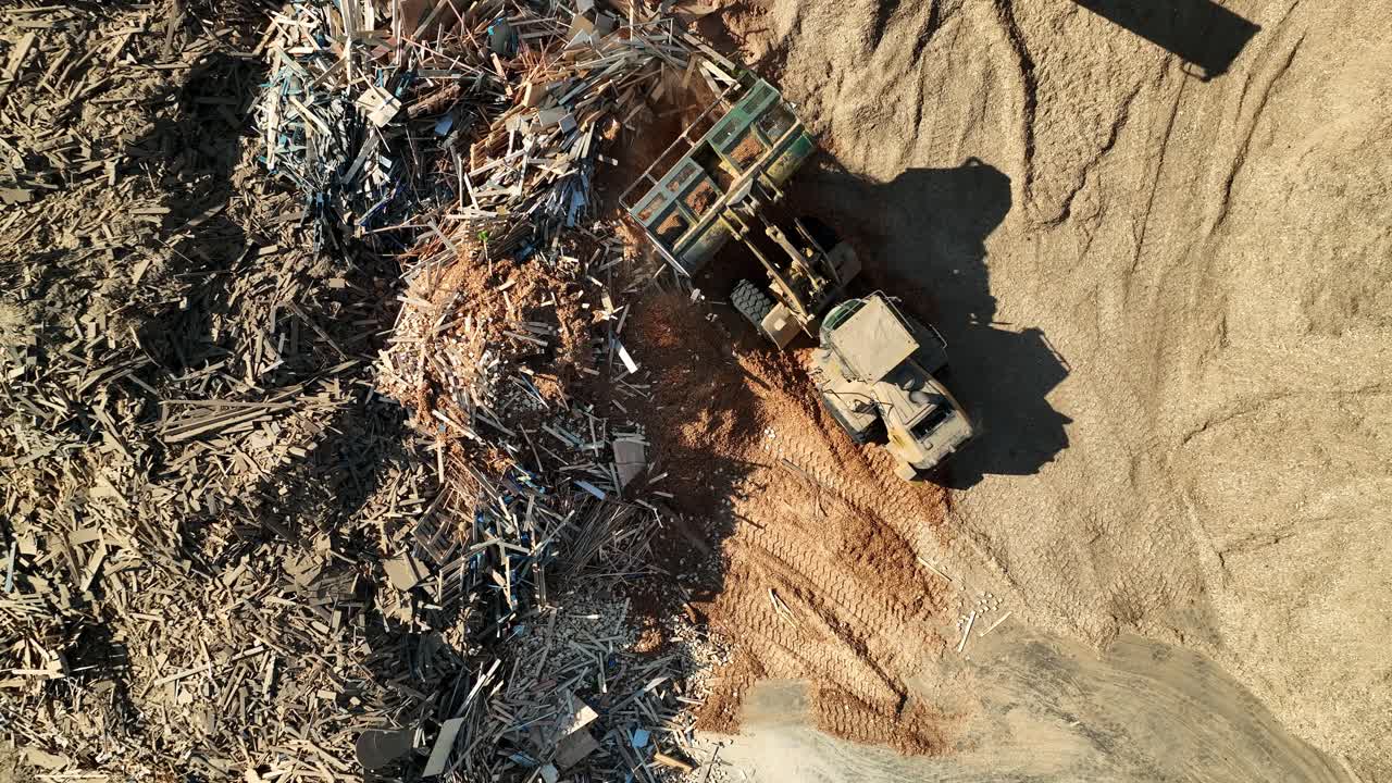 Loader Piling Sawdust At Recycling Area Of Wood In Canada