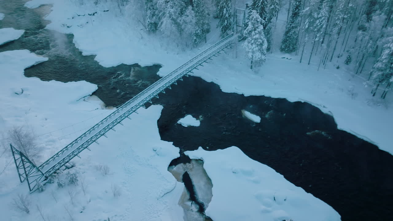 Steel Bridge Over The Vikakongas River With Snow And Ice At Winter In Finland