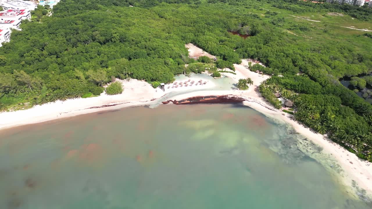 Aerial view of Playa Esmeralda, serene beach, lush greenery in Mexico