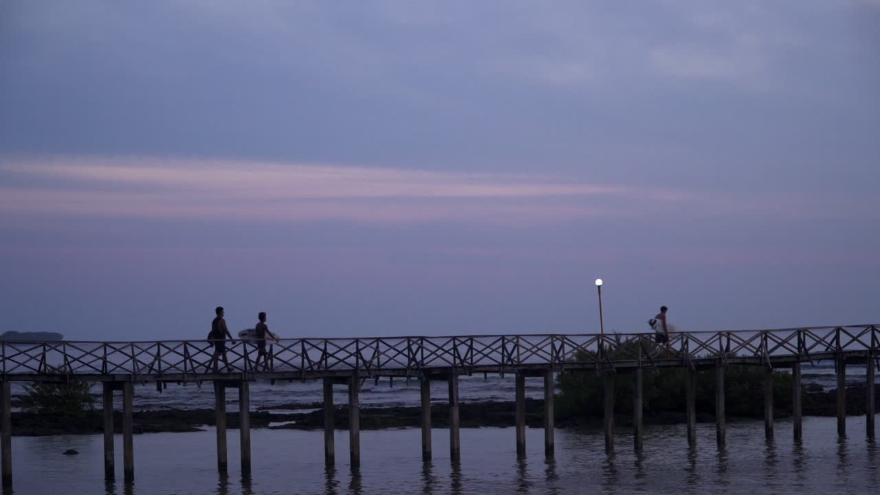 Tracking shot of surfers preparing to participate in a surfing competition at Cloud 9 in Siargao, filmed in UHD 4k