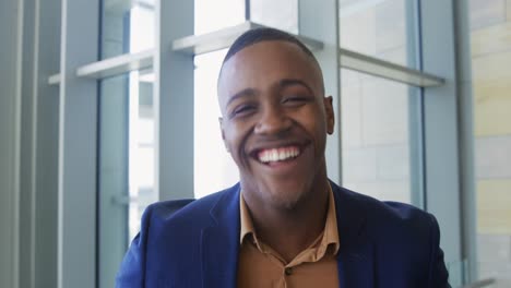 Portrait-of-a-young-businessman-in-a-modern-office-building