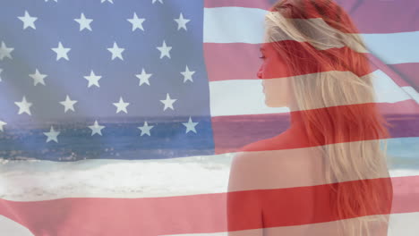 Animation-of-flag-of-usa-over-caucasian-woman-on-beach-in-summer