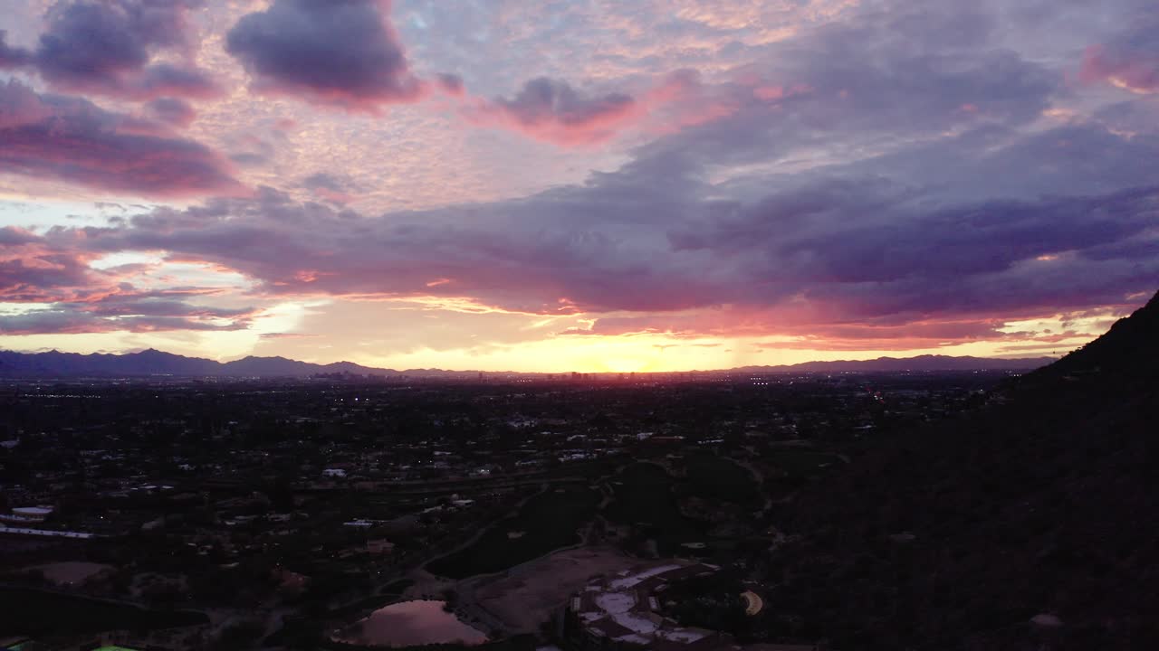 Wide sunset shot over Scottsdale, Arizona during a light pink sunset