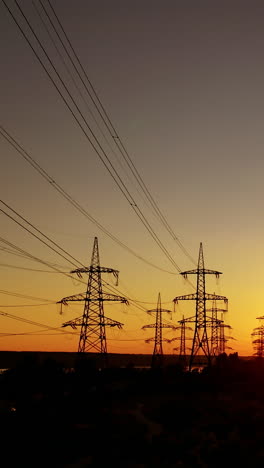 high voltage post. aerial view of power lines in natural landscape