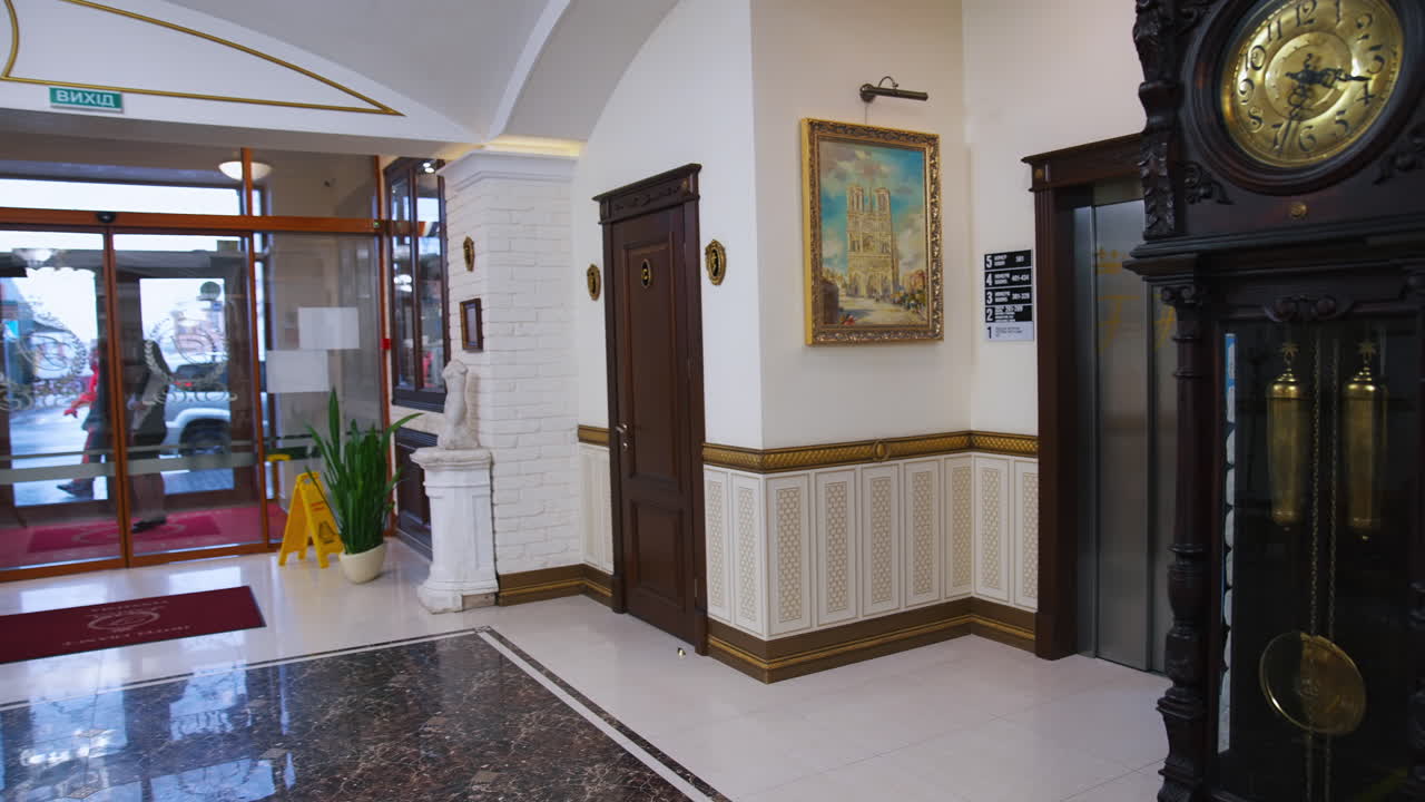 Young businesswoman standing in elevator. Young business lady in elevator at hotel