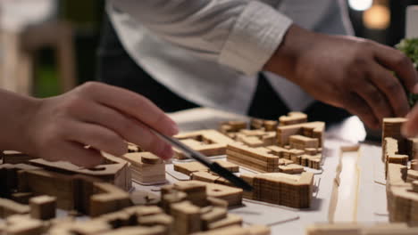 vertical video close up of developers work together on layout city planning initiative