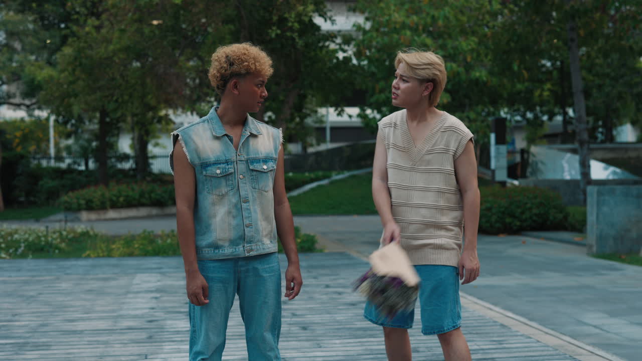 Two Men Fighting with Flowers in a Park