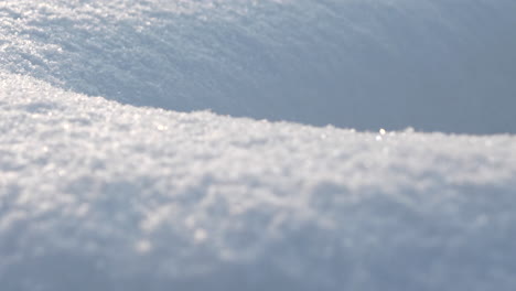 crystal clear snow dunes in macro camera motion shot