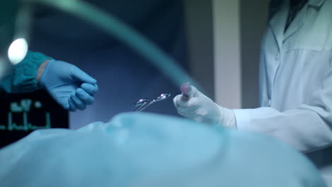 surgery hand give blood syringe. surgery hands during procedure