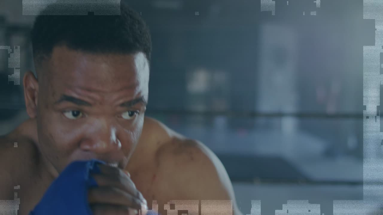 Male boxer throwing jab in boxing gym, glitching Level Up text overlaying blue wraps while training