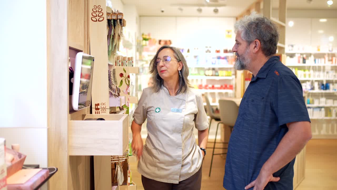 Pharmacist assisting a customer in a pharmacy
