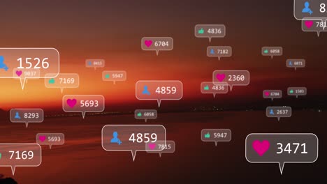 Animation-of-social-media-icons-over-sunset-and-sea-landscape