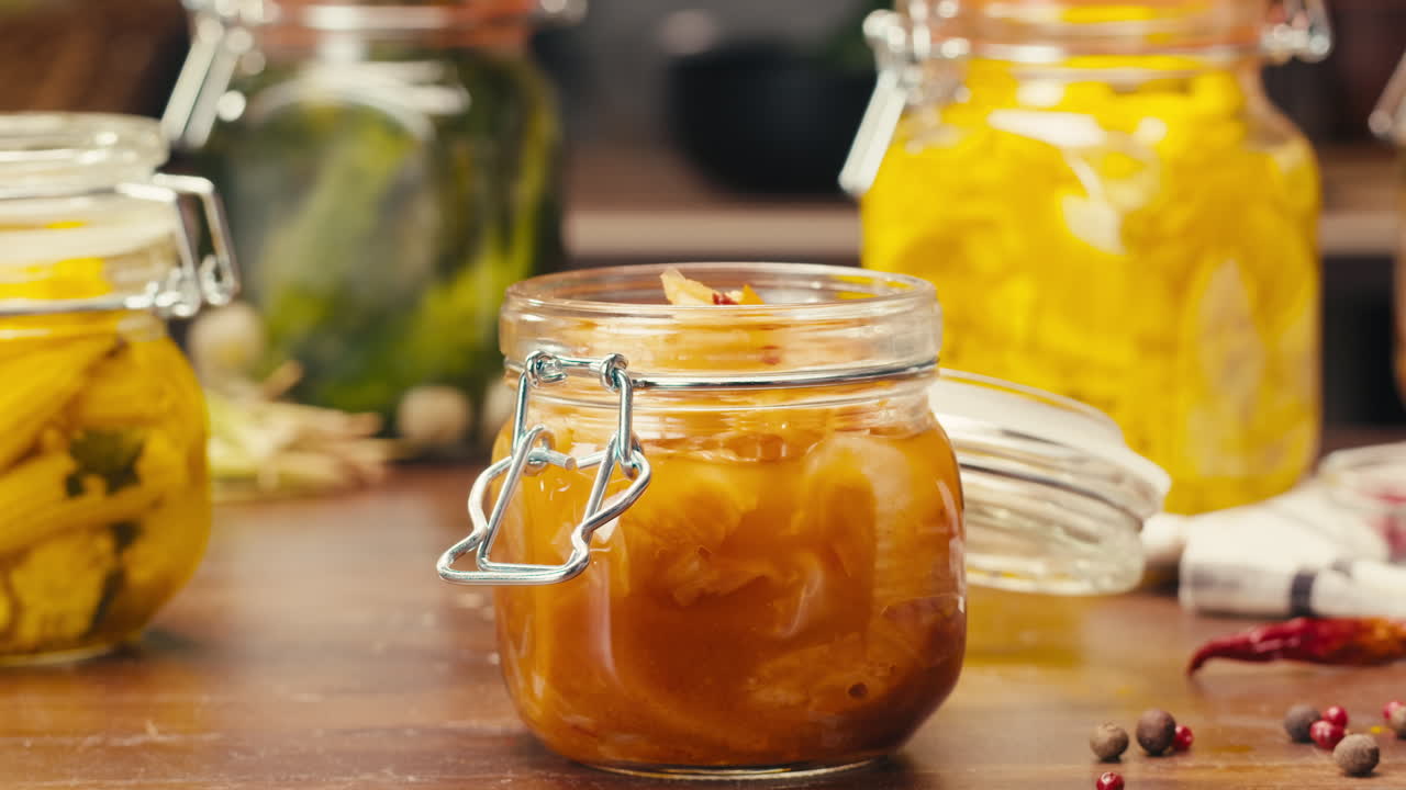 Close-up of fermented spicy cabbage kimchi with in can. Preservation of vegetables in glass jars. Fermentation preserved kimchi cabbage with spices. Asian cuisine.