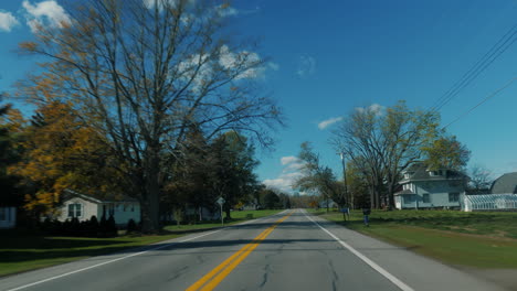 drive on an american road, around residential buildings - typical of the suburbs of the united states