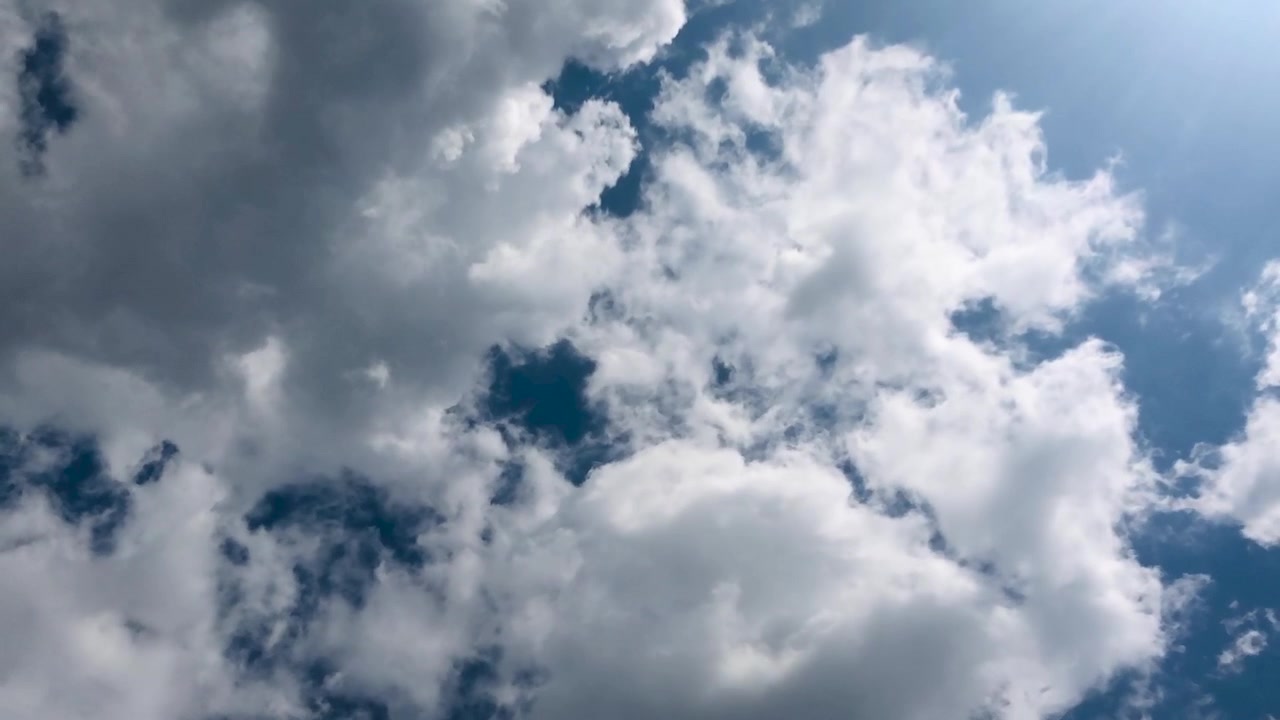 Time Lapse of White and Grey Clouds Moving Across a Blue Sky