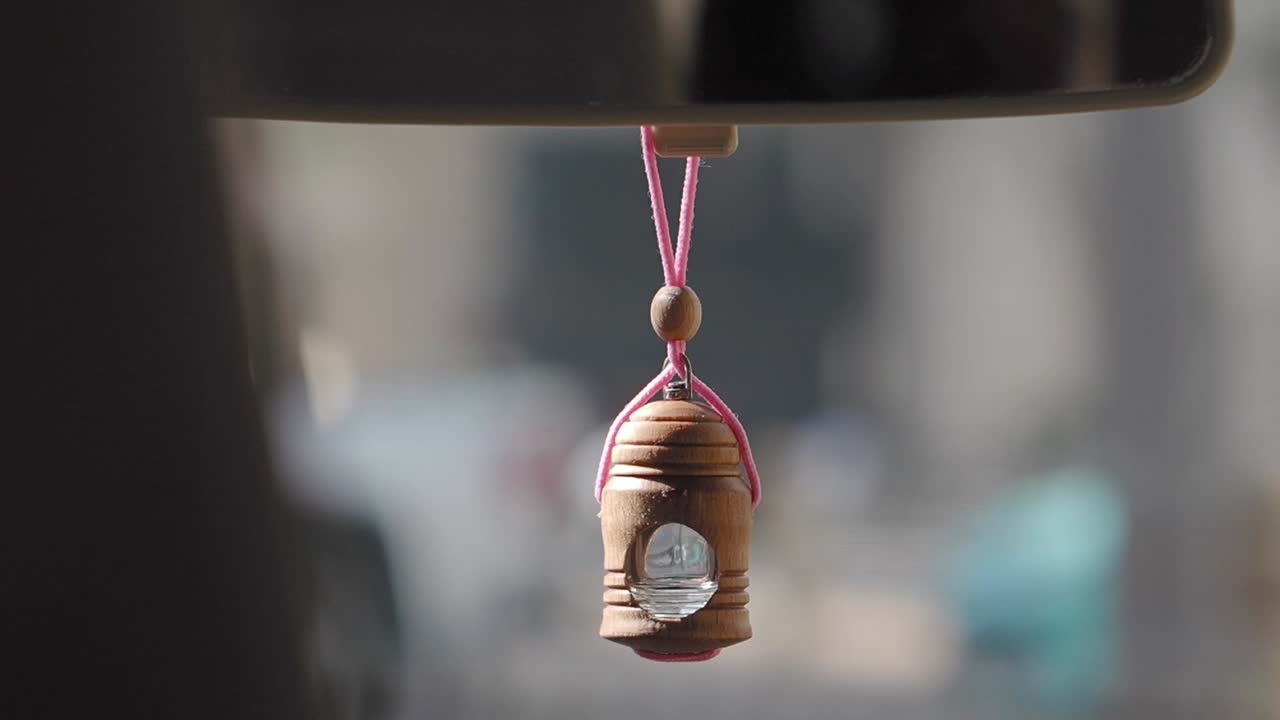 Car Air Freshener Hanging from Rearview Mirror
