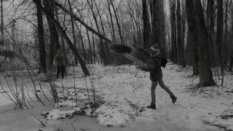 Shooting-video-of-teen-boy-taking-away-tire-from-path-in-park