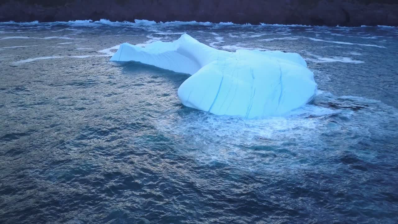 Iceberg floating near the coast