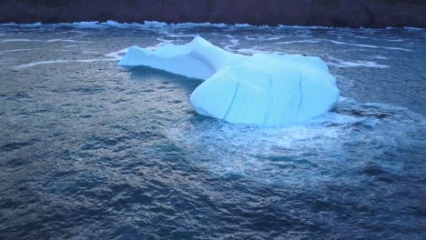 iceberg floating near the coast
