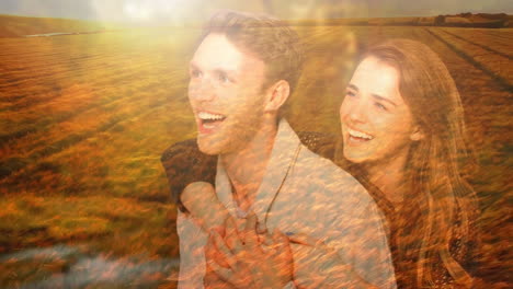 pareja riendo abrazándose sobre el campo dorado al atardecer, animación de felicidad y amor