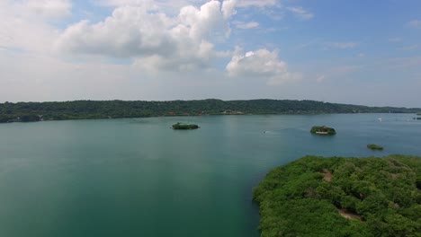 rising aerial shot of calm bay in baru, near cartagena, colombia.
