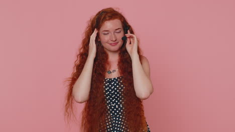 smiling redhead girl wears headset, freelance worker, call center, support service operator helpline