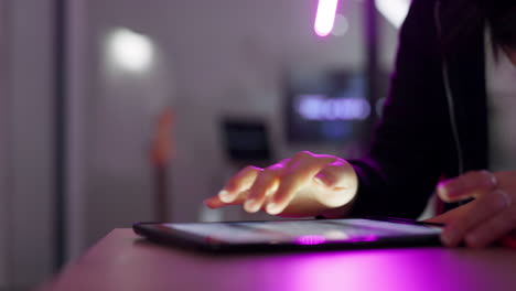tablet, digital and woman hands typing in neon