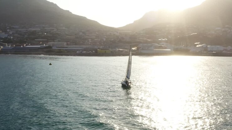 A Yacht Sailing Back To The Bay