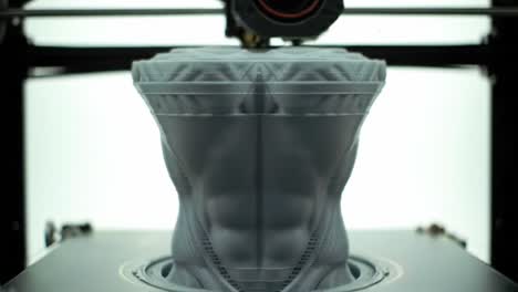 a close-up view of a 3d printer creating a sculptural object with intricate details, showcasing the artistry of modern manufacturing techniques and design innovation