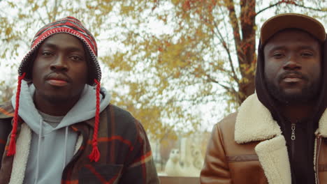 portrait of two african american men in park