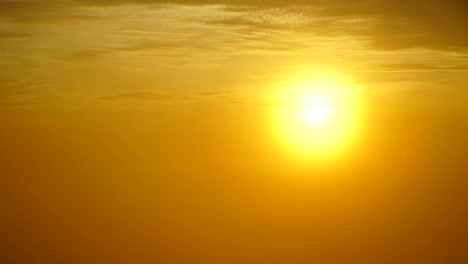 time lapse of sunrise or sunset, above the clouds,clouds billowing.