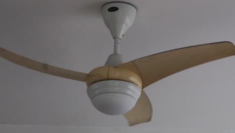 a ceiling fan rotating at different angles