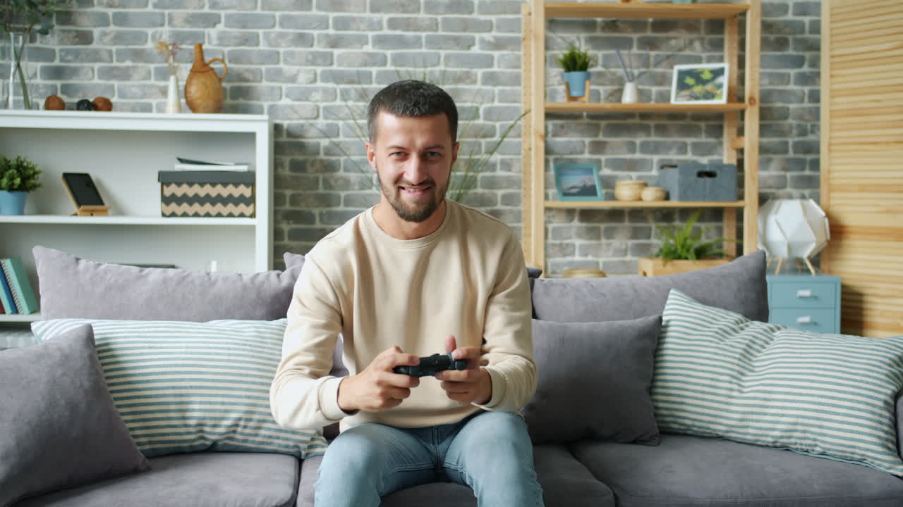 Man Playing Video Games on Couch