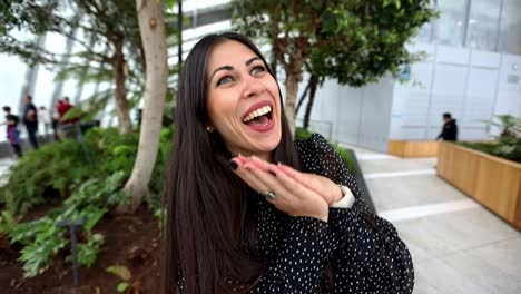 a beautiful happy and excited woman enjoying the moment then looking at camera