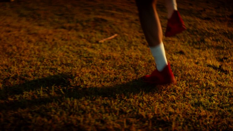 Child Running on Grass at Night