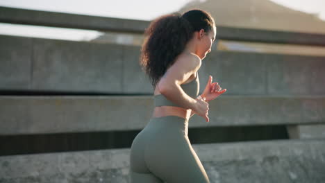 Woman,-fitness-and-running-in-city-for-workout