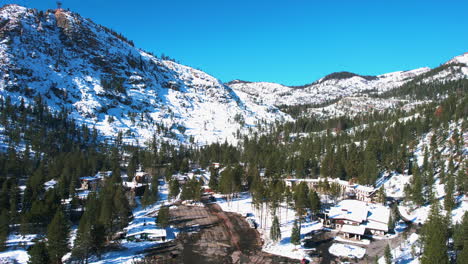 Aerial-View-of-Lake-Tahoe-Ski-Resort-on-Sunny-Winter-Day,-Palisades,-Olympic-Valley,-Drone-Shot