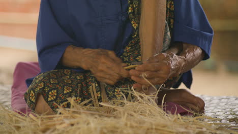 local villager at bo sang umbrella workshop near chiang mai, thailand. close-up shot
