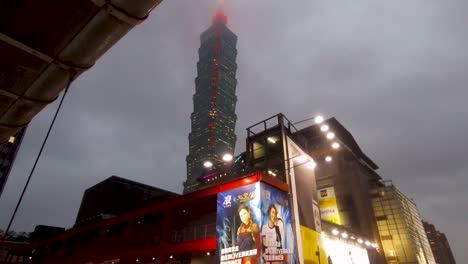 taipei 101 cloudy top rainy night walk forward