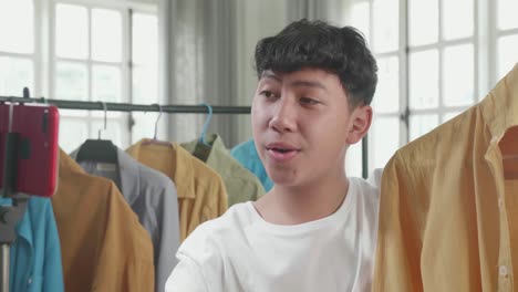 young man reviews clothes online
