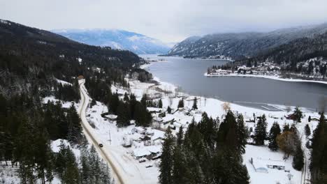 Snowy-Wonderland-of-Adams-Lake-and-Mountainous-Forests,-Drone-Flight-Overhead