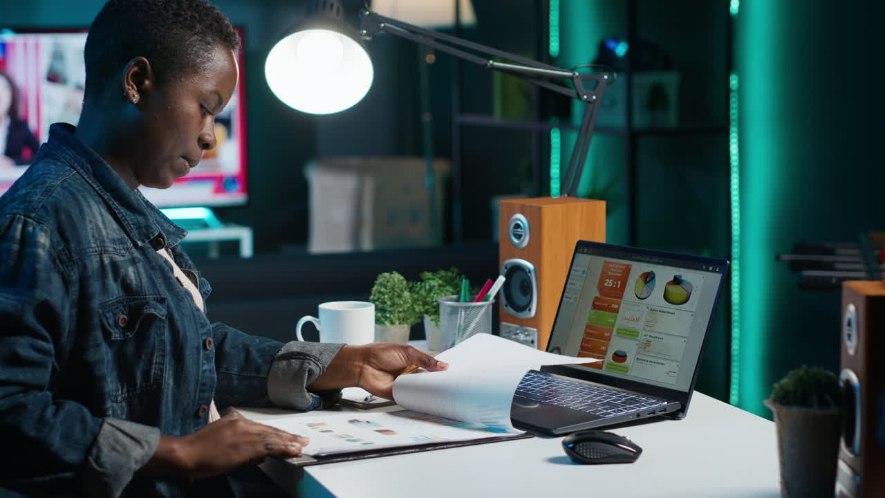 Woman working late night on computer analysis