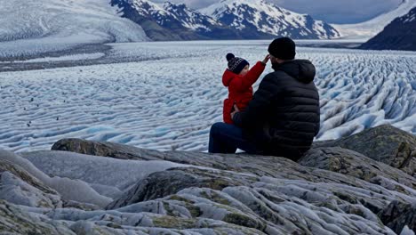 father and son enjoying a glacier view