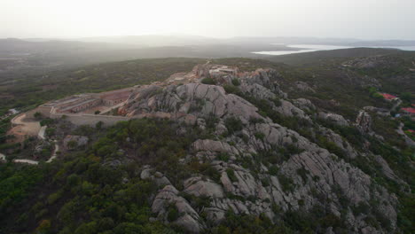 La-Fortezza-di-Monte-Altura,-Sardinia:-Aerial-view-in-approach-and-during-sunset-over-this-beautiful-fortress