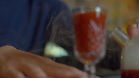 bartender preparing a hot cocktail