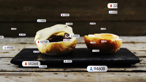 social media interaction animation over burgers on black slate