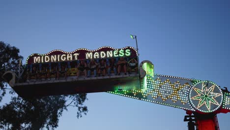 amusement park ride swings with colorful lights