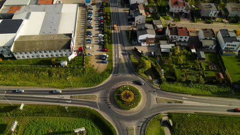 Cars-Driving-In-Roundabout-Road-At-Sunset-In-Lubawa,-Poland