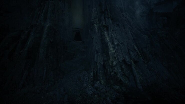 Formidable vertical basalt wall with concealed ominous opening